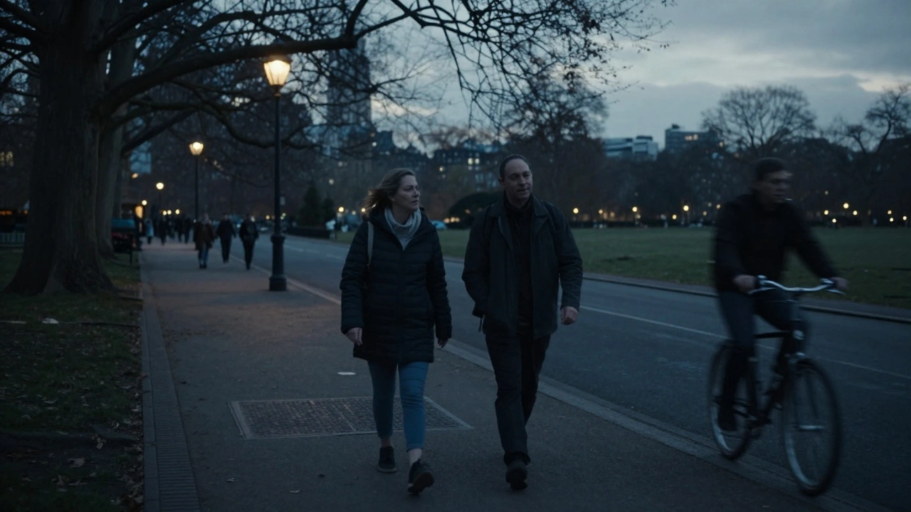A person and escort walking peacefully through Hyde Park at dusk, enjoying silent companionship.