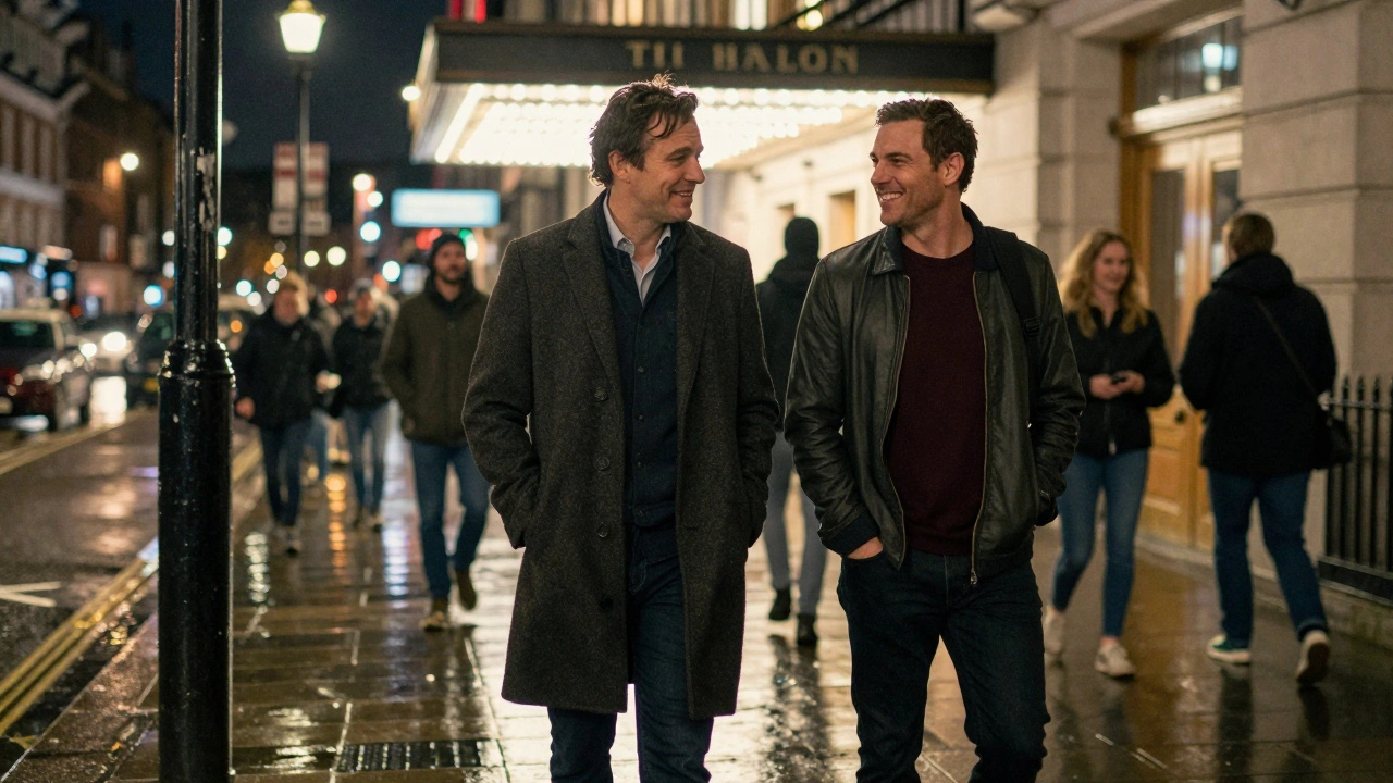 Two men walking together at night in London, heading to a theater in comfortable companionship.